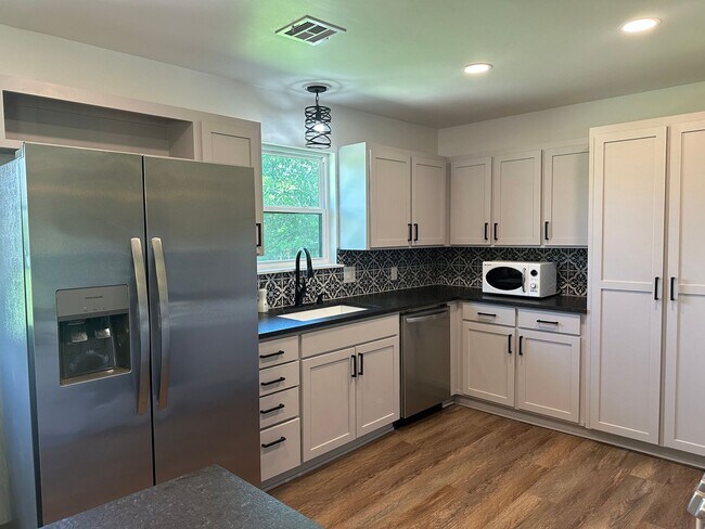 Building Photo - Welcome to country living with a fresh, modern twist.
