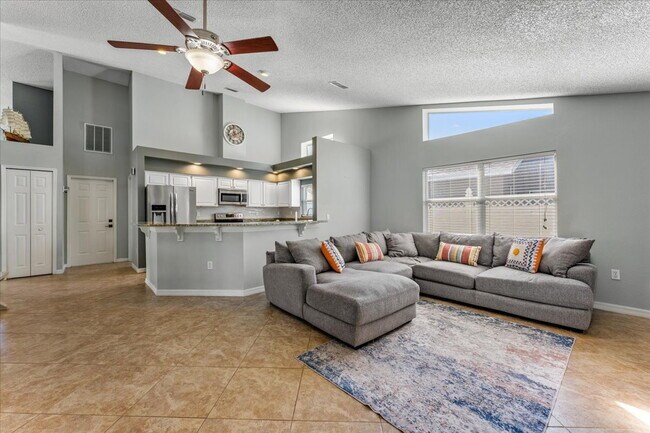 Building Photo - A vibrant 2-bedroom, 2-bathroom tropical retreat designed for both high-energy entertaining and l...
