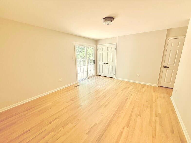 Main floor primary with ample closets - 9248 Wood Glade Dr