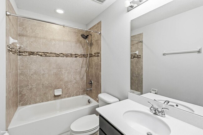 Building Photo - Bright & Stylish 3-Bedroom Townhome with Pond Views in Gated Seven Oaks