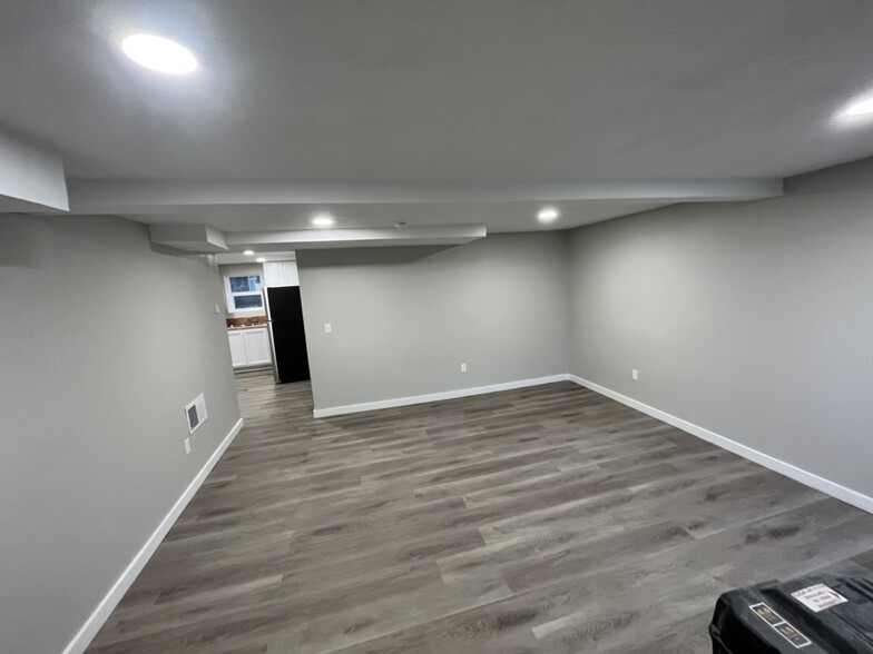 Fresh, clean living room space. - 237 W 16th St