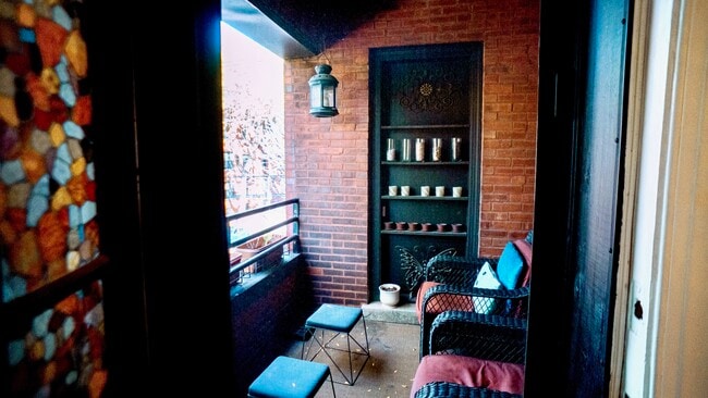 Outdoor balcony facing tree lined street - 6709 N Lakewood Ave
