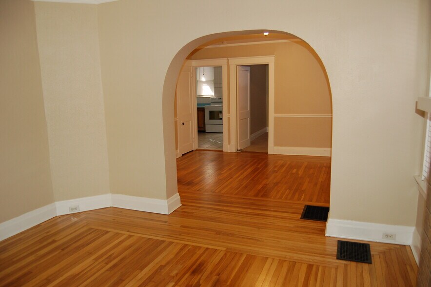 through large center room to kitchen on left and bedroom door on right - 703 Willard St