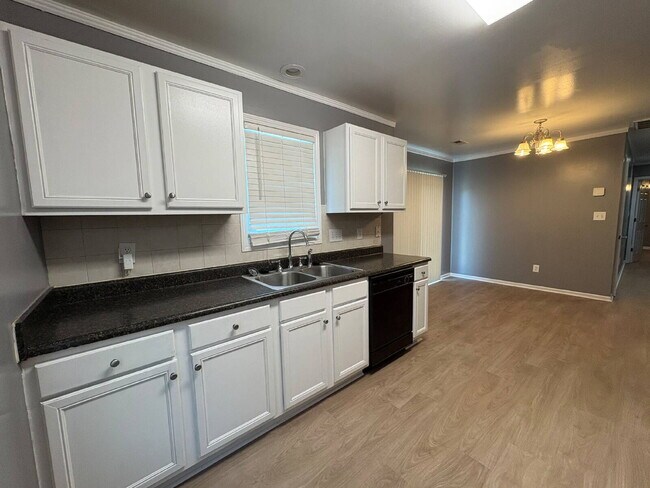 Building Photo - Spacious 4-Bedroom Sanctuary with Cozy Fireplace on Chimney Swift Drive!