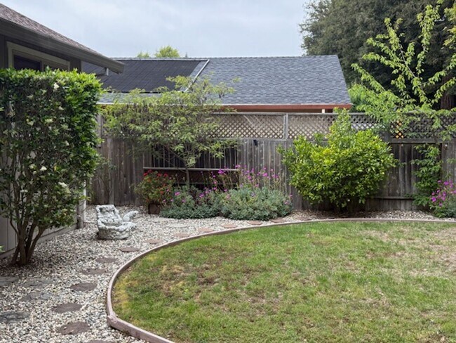 Building Photo - Private Redwood Setting | 4BR Home with Family Room, Bar & Garage Workspace - Available Now