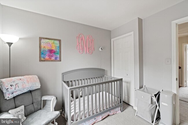 Baby furniture has been replaced with full size bed, end tables and lamp - 6908 Compton Valley Ct