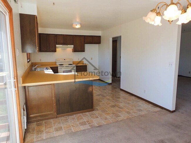 Building Photo - Spacious 4 Bedroom Home with Fenced Backyard & Garage