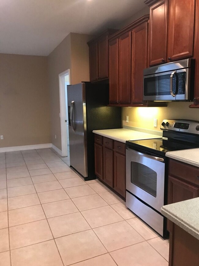 Building Photo - MOVE IN SPECIAL- Charming 3/2 home w/ formal office/4th bedroom and fenced yard in Harmony