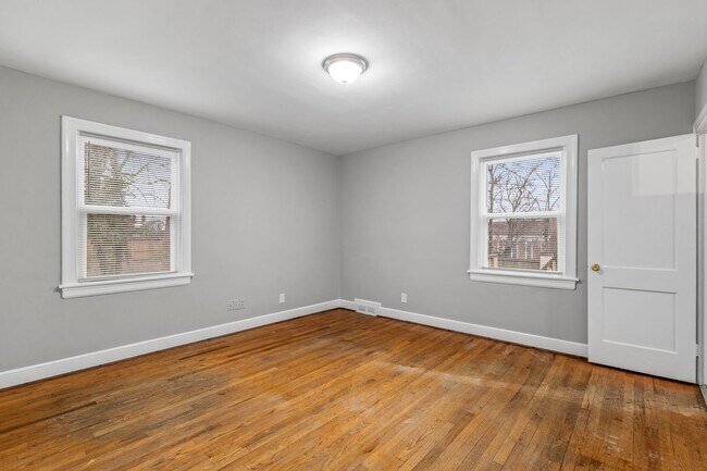 Building Photo - Brick home, Two Story, Hardwoods, DR, 2 Sun Rooms, FP, Carport!.