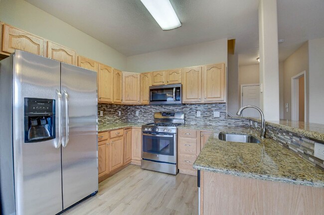 Building Photo - Updated Townhome Near Fort Carson with Unm...