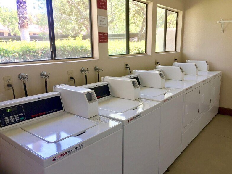 Laundry facility conveniently located in the building on the first floor. - 685 N Ashurst Ct