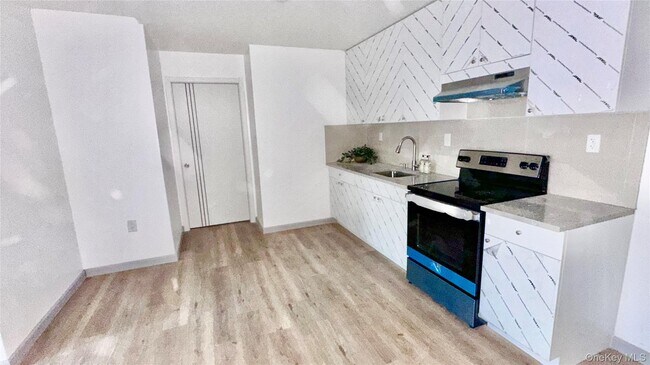 Building Photo - 70-25 Queens Blvd