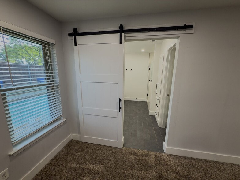 Barn door entry to en-suite bathroom - 2006 Candle Ct