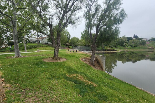 Building Photo - Gorgeous 2 bedroom newly renovated upstairs corner condo in gated community with pool & hill side...