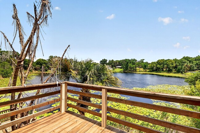 Building Photo - Available Now! Waterfront Living at Its Best – Pool, Decks & Gated Privacy