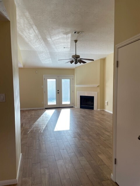 Family room with gas fireplace and french doors out to back deck. - 29015 Waltham St