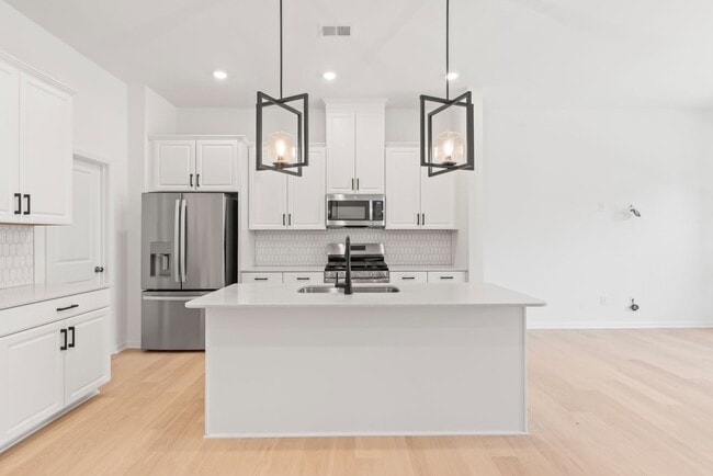 Building Photo - Welcome home to this stunning brand-new townhome in one of Indian Trail's newest and most desirab...