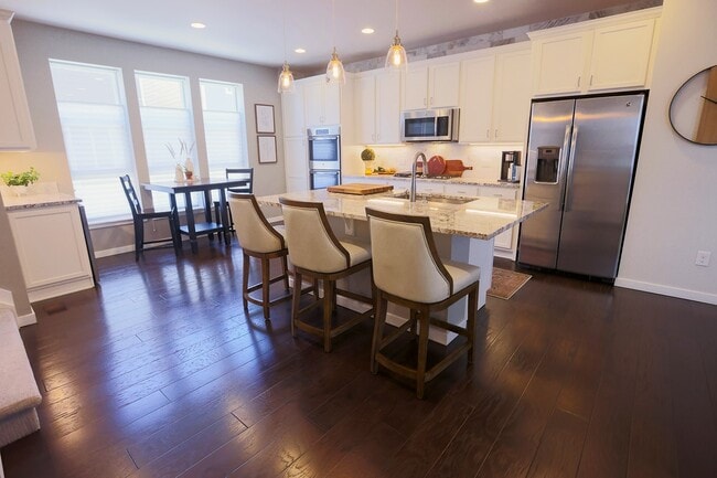 Gourmet kitchen w/double oven, gas range, and beverage bar. All appliances included. - 15637 E Broncos Pl