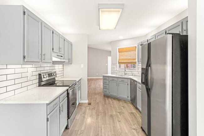 Building Photo - Fully Updated - Beautiful 3BR/2BA single-level home with a finished walk-out basement!