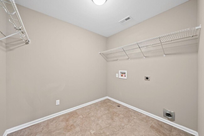 Building Photo - Four Bedroom with Three Car Garage!