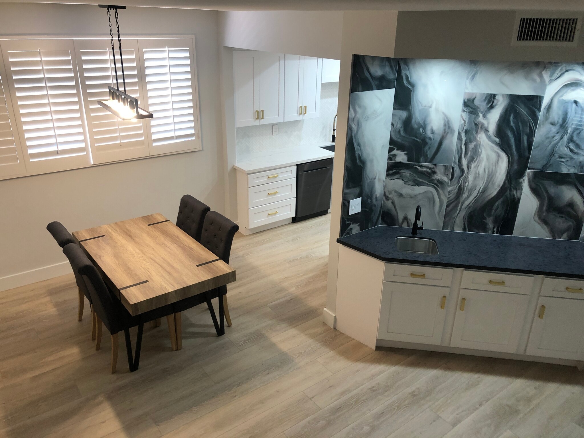 View from stairs down into kitchen table - 1412 N Crescent Heights Blvd