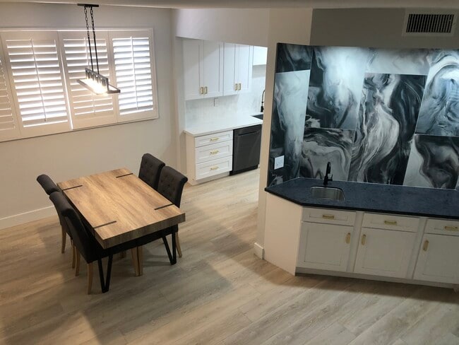 View from stairs down into kitchen table - 1412 N Crescent Heights Blvd