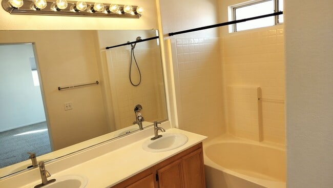 Building Photo - Townhome with Loft + Two Bedrooms/Baths - Designed for Comfort in Gated Community