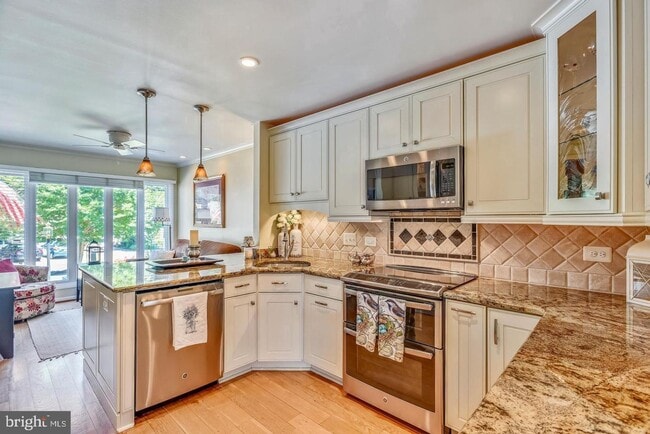 Building Photo - Experience elevated living in this beautifully renovated townhome nestled within the highly sough...