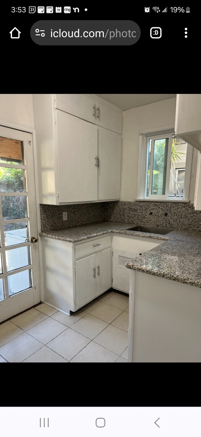 Kitchen has door to backyard - 116 S Dillon St