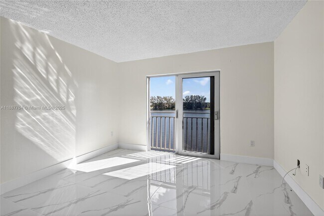 Building Photo - 9915 W Okeechobee Rd