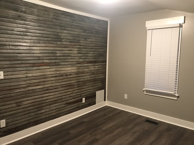 Master bedroom with accent wall - 204 Spring St