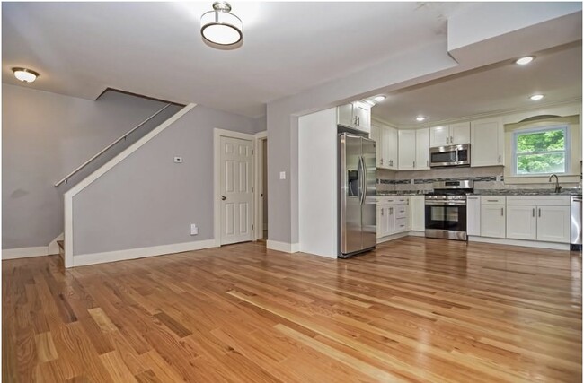 Open concept kitchen & living room; interior entry to basement storage - 237 Standish Ave