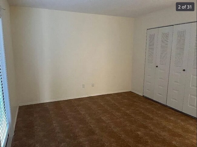 Building Photo - 2/2/1 home with a spacious fenced backyard...