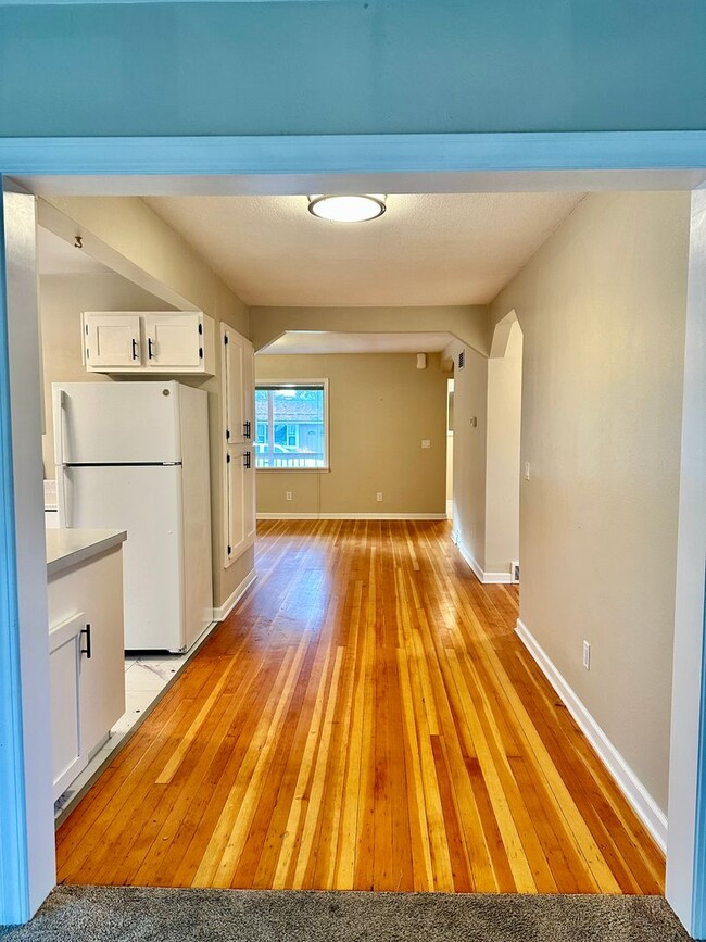 Building Photo - Stunning 2 level home with wood floors and...