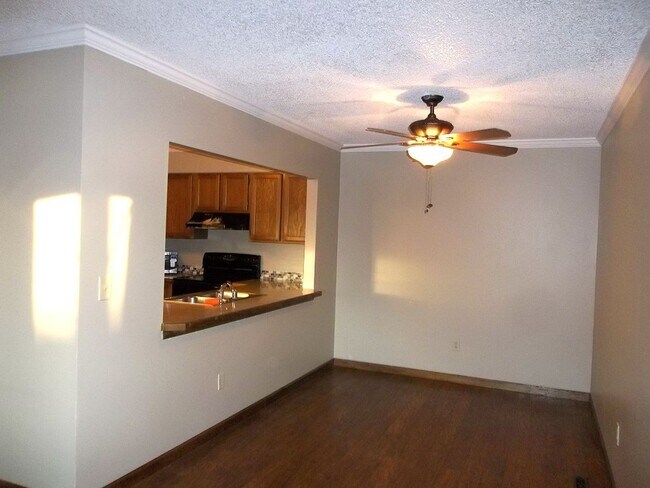 Building Photo - $500 OFF First Month | Charming 2BR Townhome with Garage