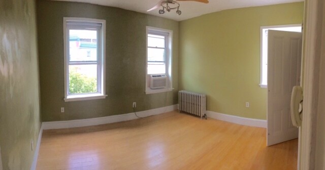 2nd Floor Rear bedroom(12' x 14'). Fits queen bed. Double closets. - 1229 E Susquehanna Ave