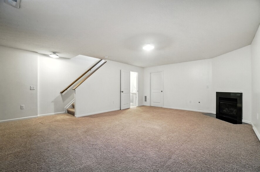 Basement with half bathroom and large storage room - 6169 Needletail Rd