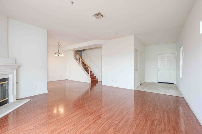 Building Photo - Gated Townhome with Updated Kitchen and Private Backyard