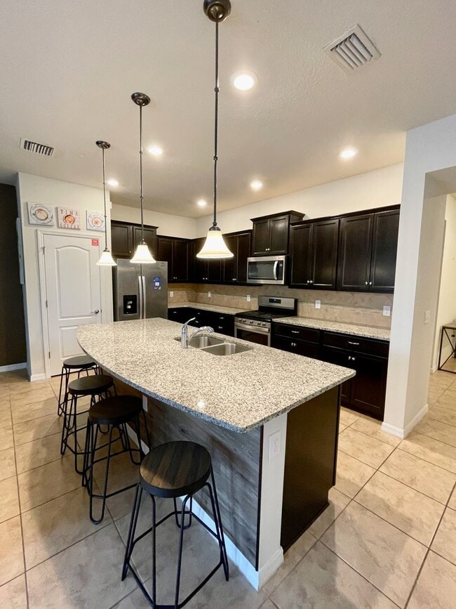 Building Photo - Spacious 5-Bed / 4.5-Bath Townhome w/ Private Pool & Sundeck in Gated Oakmont at Solterra Near Di...