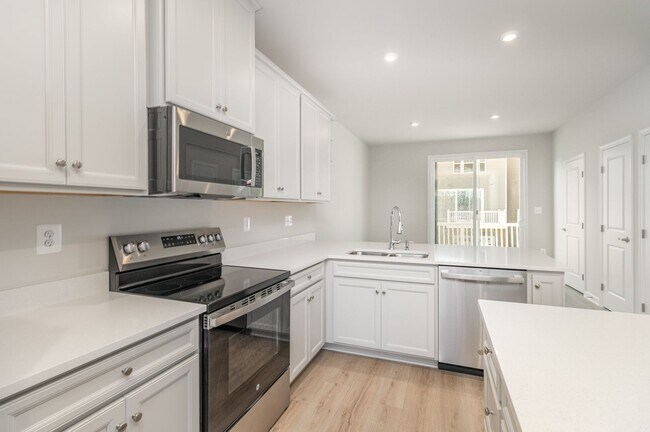 Building Photo - New Construction 3 Bedroom Townhome in Fre...