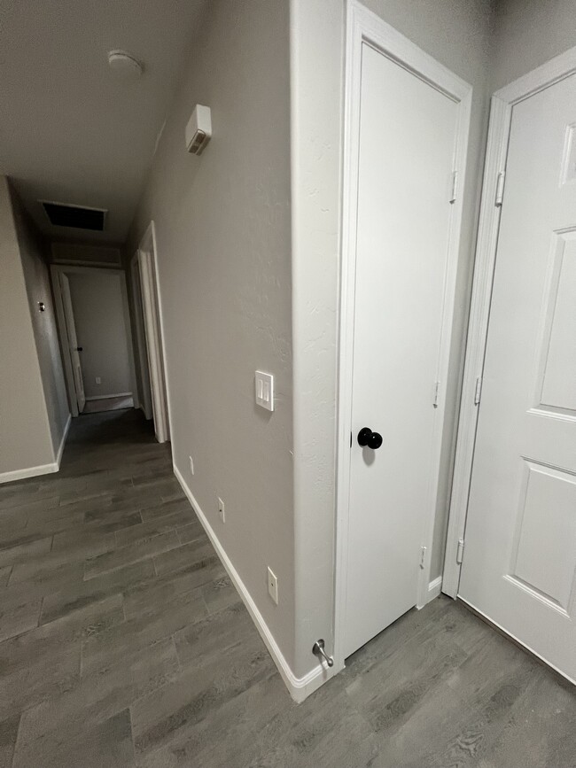 Hallway and exit to garage - 8268 W Magnum Dr