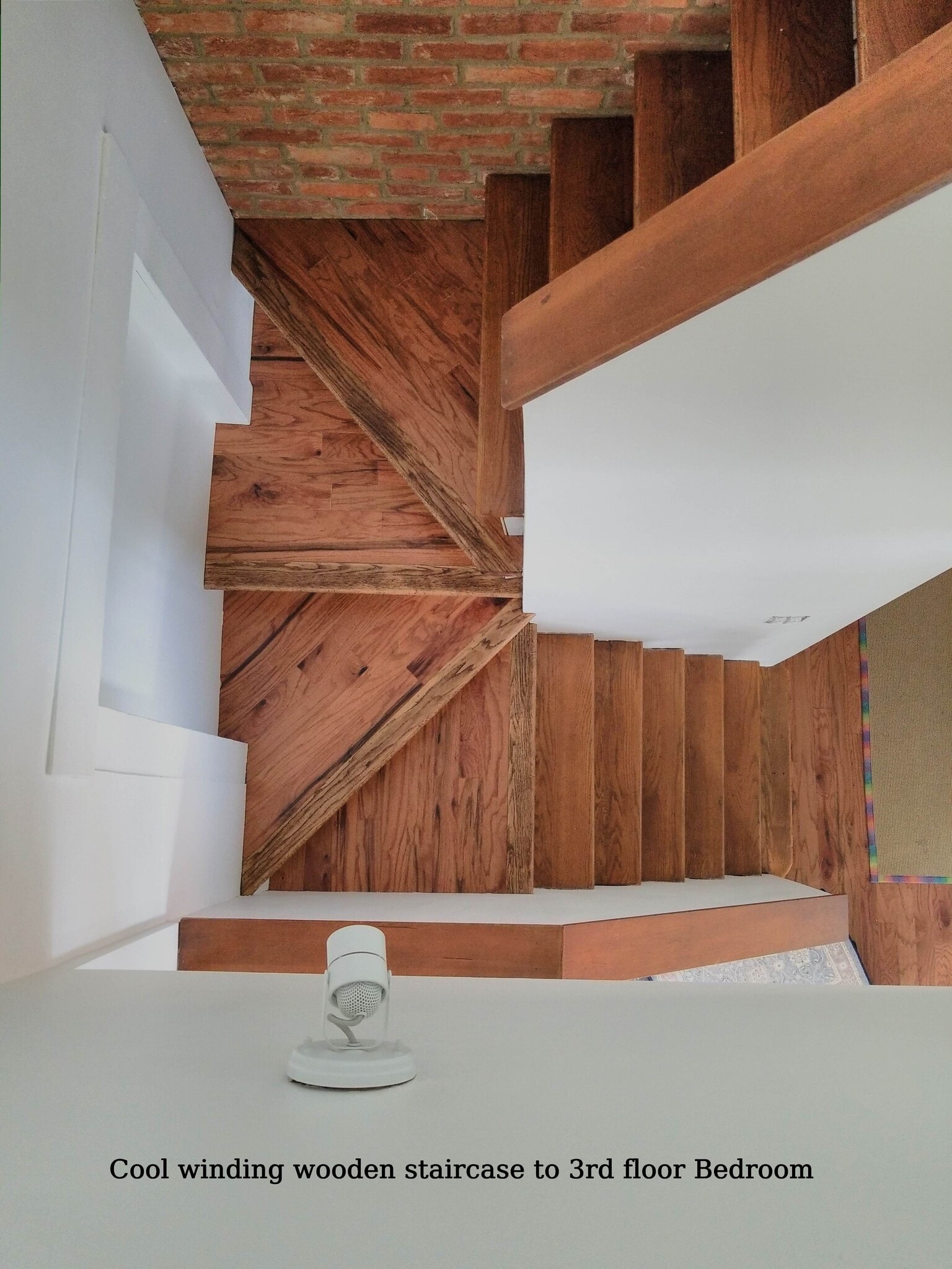 Wooden winding stairs to 3rd floor - 810 E Washington St