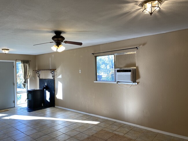 Living Area w/ A/C unit & pellet stove - 3333 Hamblen Ct