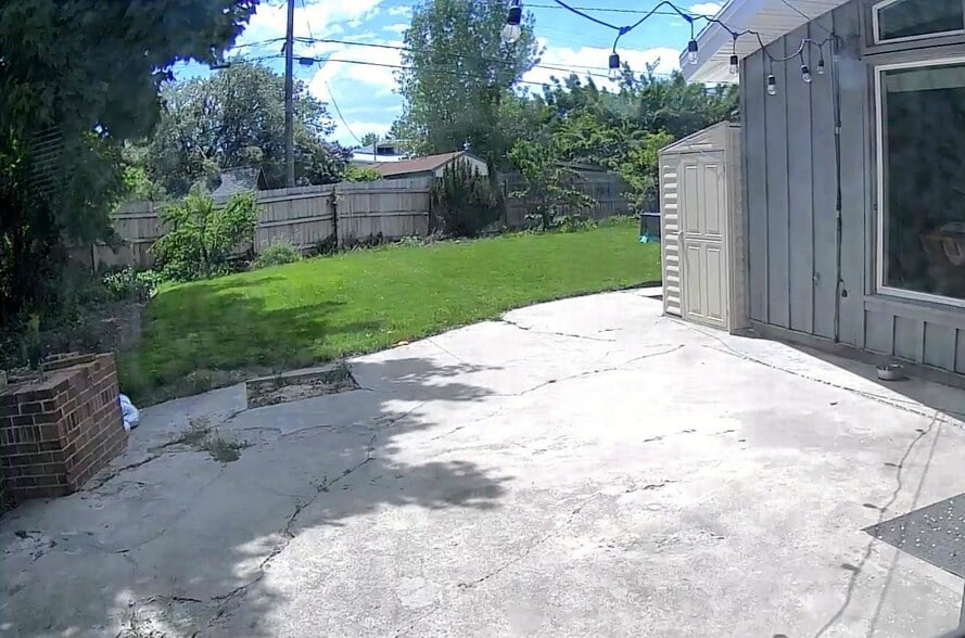 Back patio (patio table and chairs not pictured) - 3230 E 3900 S