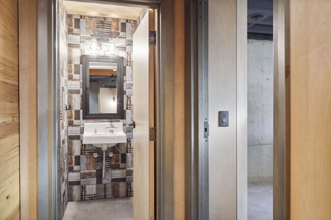 Custom steel door frames with an onsite aged patina. - 924 Eleanor Ave