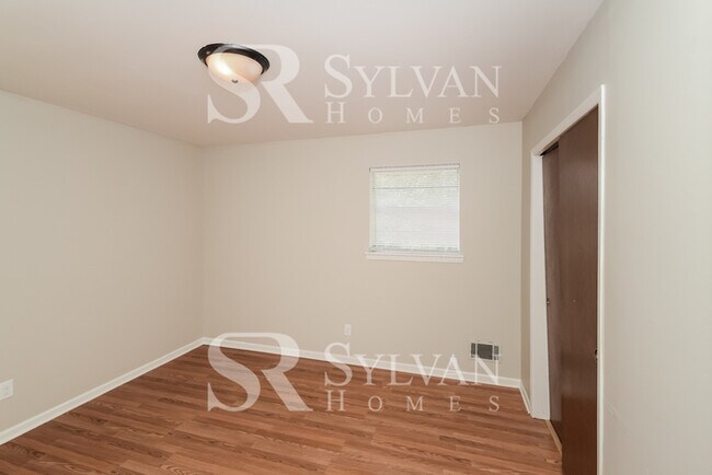 Building Photo - Welcome to this charming abode.