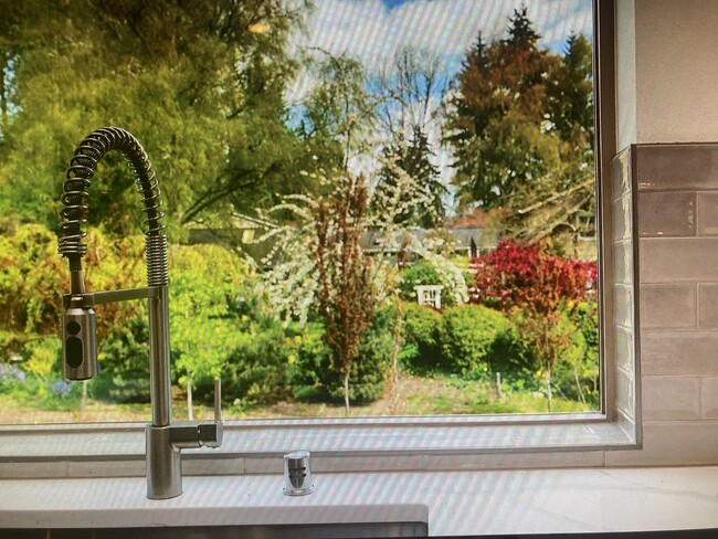 Kitchen sink looking out to gardens - 156 Whispering Ln NW