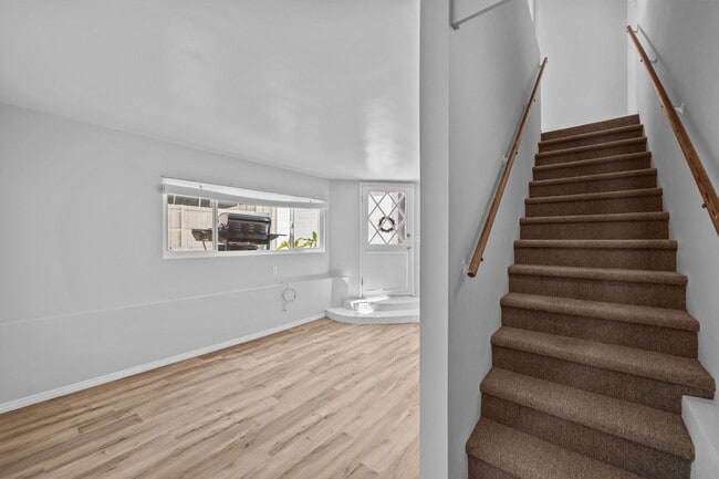 living room and staircase - 3525 N Poinsettia Ave