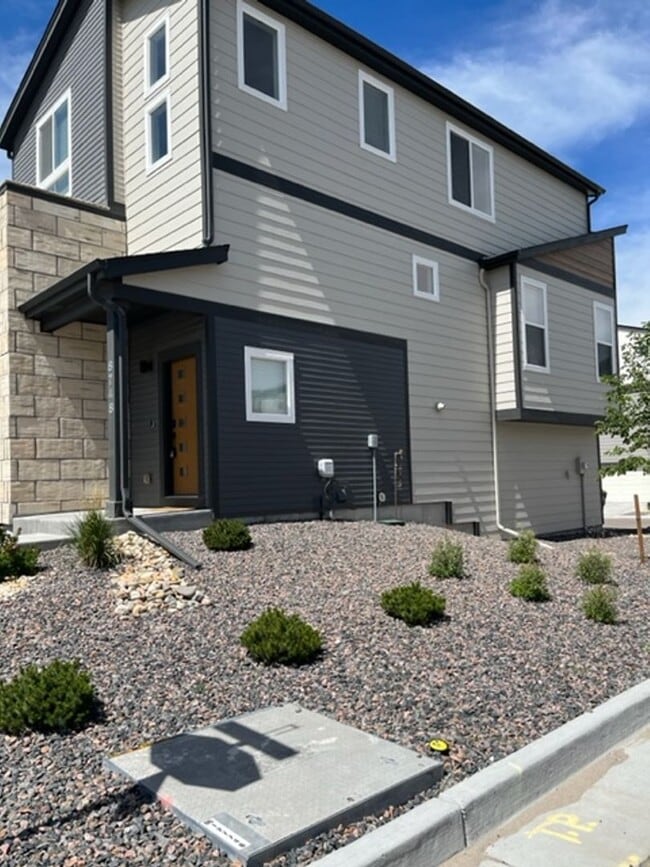 Building Photo - MODERN THREE STORY TOWNHOME WITH 2 CAR GAR...