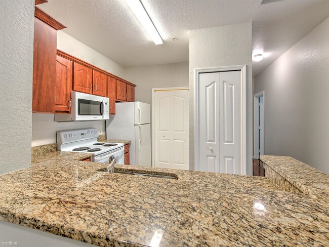 Building Photo - 2 br, 1 bath Condo - 5703 Legacy Crescent ...